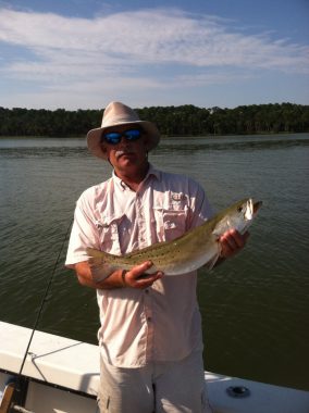 Apalachicola Bay Fishing Charters - Woodduck Holding a Trout caught in Apalachicola