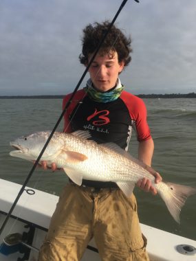 St George Island Fishing - Boy holding redfish caught on fishing trip