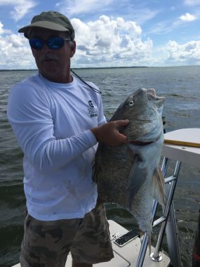 Woodduck holding a drum bitten in half - St. George Island Fishing Guide