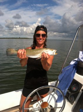 Apalachicola Charter Fishing - Happy Fishing client holding a Trout