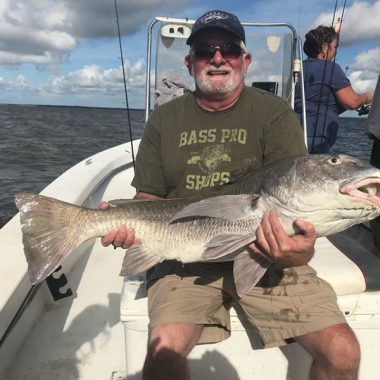 St. George Island Fishing - Man holding huge Drum