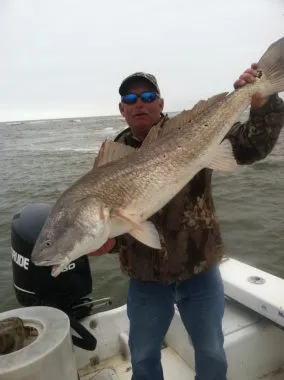 St. George Island Fishing Charters - Woodduck holding Red