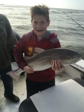 Fishing Guide in St George Island - Young boy excited about catching a redfish